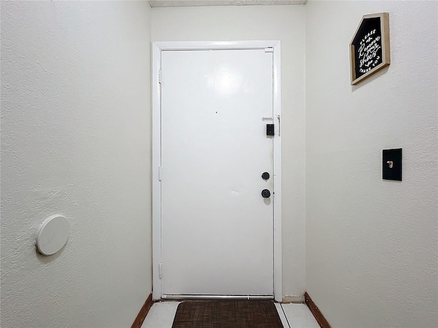 doorway featuring light tile patterned floors