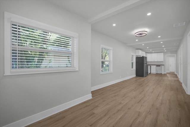 unfurnished living room featuring light hardwood / wood-style flooring