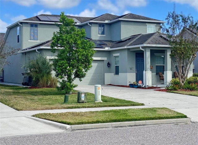 view of front facade featuring a garage and a front yard