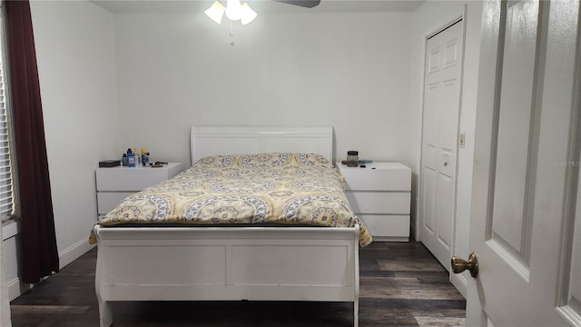 bedroom featuring a closet, ceiling fan, and dark hardwood / wood-style flooring