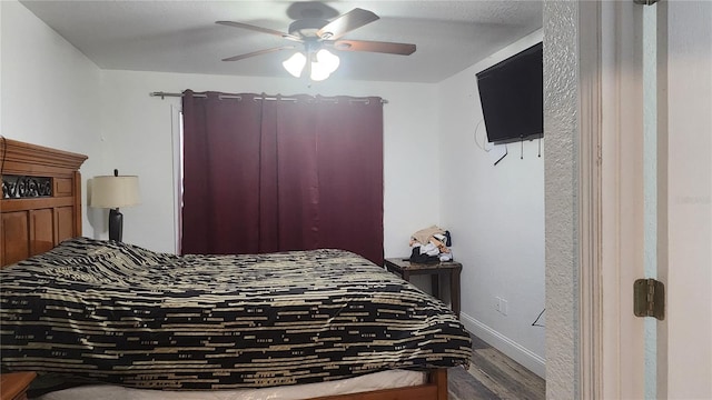 bedroom featuring ceiling fan and hardwood / wood-style floors