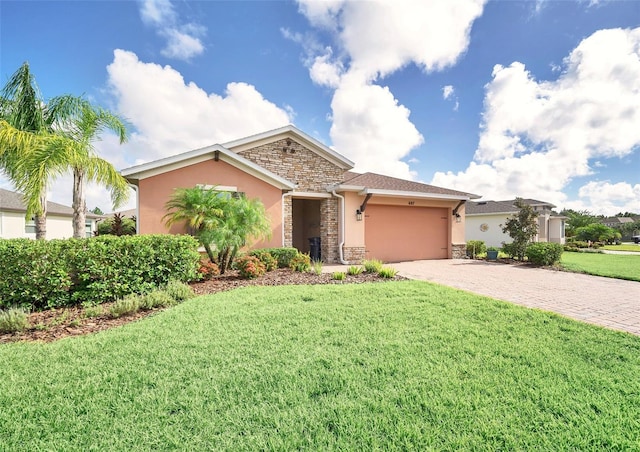 view of front facade with a front lawn and a garage