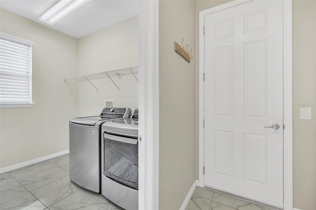 washroom featuring washing machine and clothes dryer