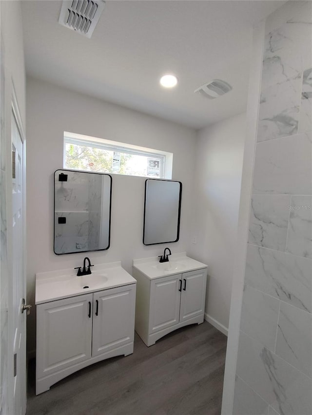 bathroom featuring vanity and wood-type flooring