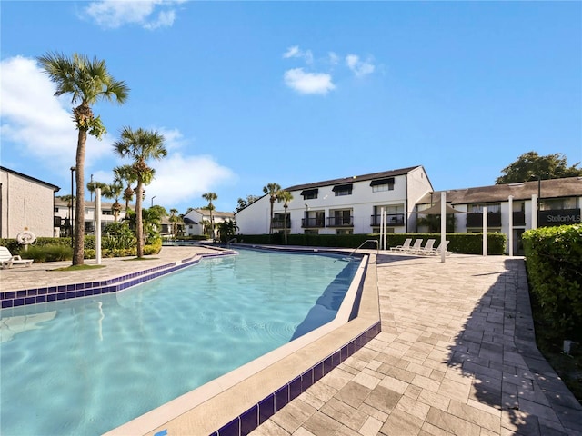 view of swimming pool with a patio area