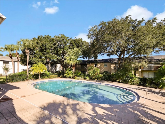 view of swimming pool featuring a patio