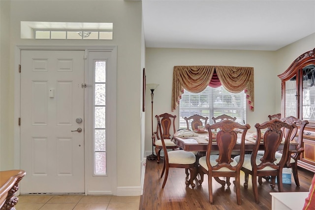 foyer entrance with a wealth of natural light and light hardwood / wood-style floors