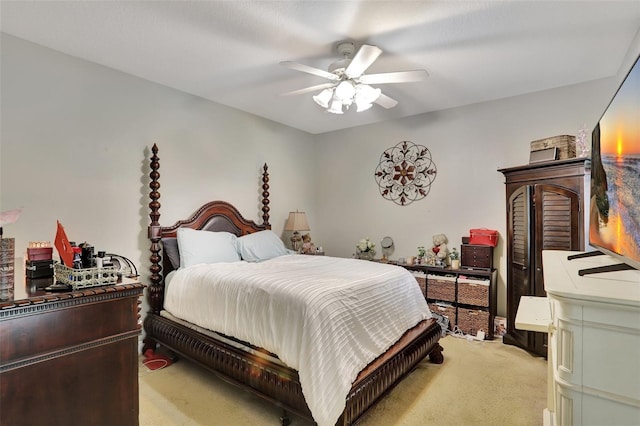 bedroom featuring light colored carpet and ceiling fan