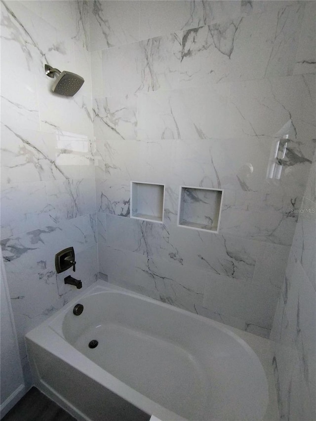 bathroom with tub / shower combination