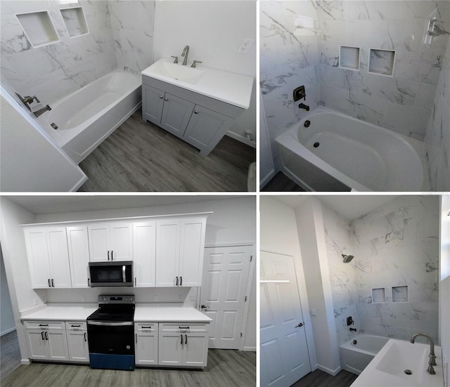 bathroom with tiled shower / bath combo, vanity, and hardwood / wood-style floors