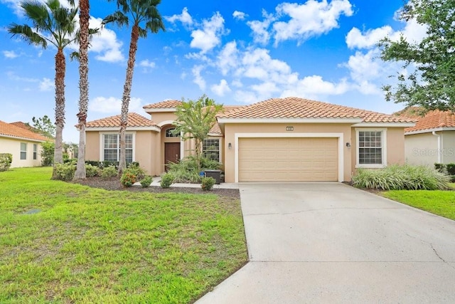 mediterranean / spanish-style home with a garage and a front lawn