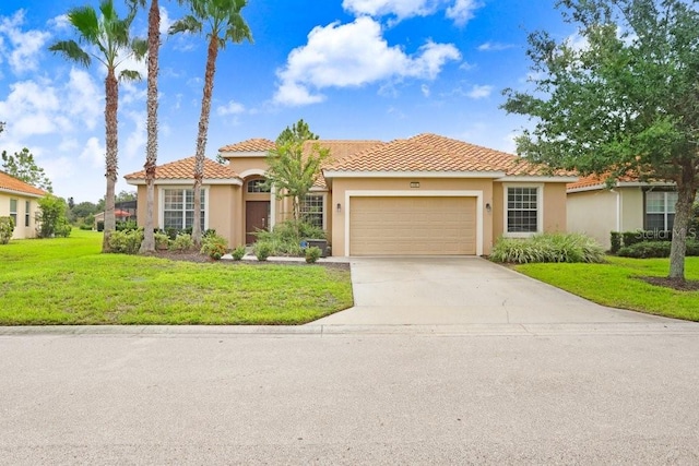 mediterranean / spanish-style house with a garage and a front yard