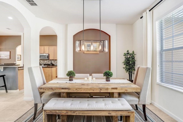 dining room featuring light tile patterned floors