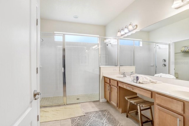 bathroom featuring vanity, tile patterned floors, and a shower with door