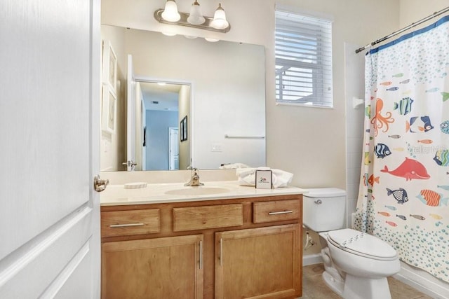 bathroom with tile patterned floors, a shower with curtain, vanity, and toilet