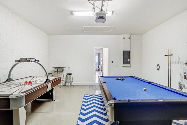 game room featuring electric panel, pool table, and a textured ceiling