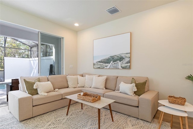 living room with light hardwood / wood-style flooring