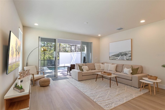 living room with light hardwood / wood-style floors