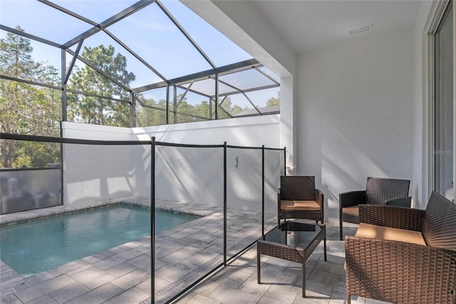 view of pool with a lanai and a patio area