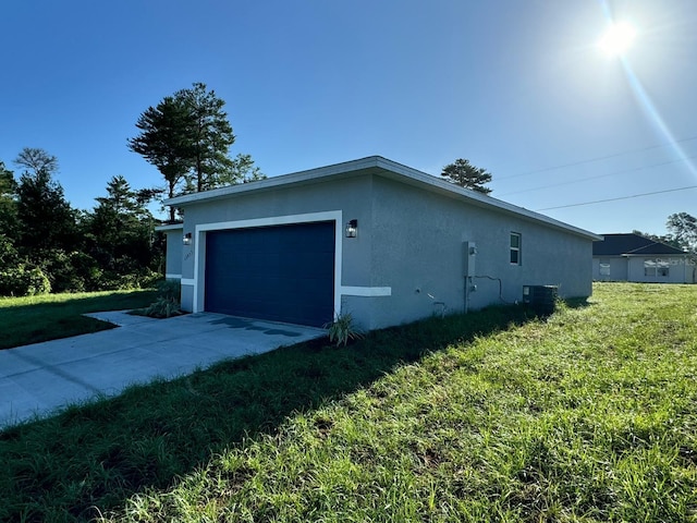 view of property exterior with a yard, central AC unit, and stucco siding