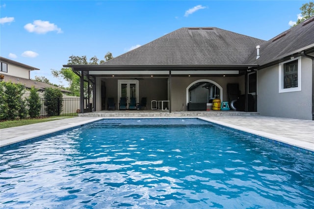 view of swimming pool featuring a patio area