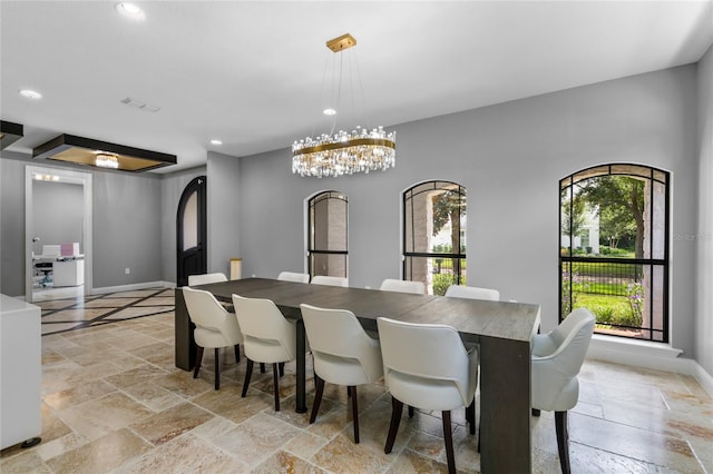 dining room featuring a notable chandelier