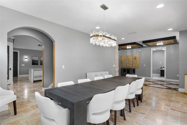 dining area featuring a chandelier