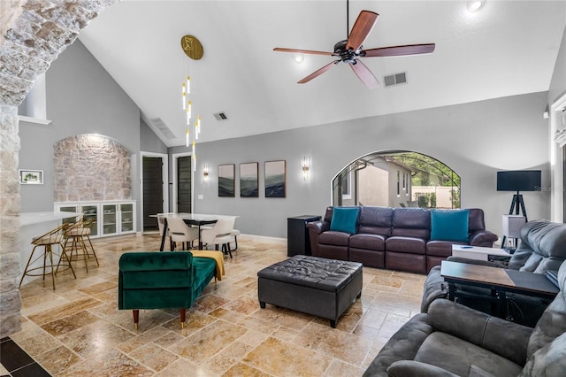 living room with high vaulted ceiling, a fireplace, and ceiling fan