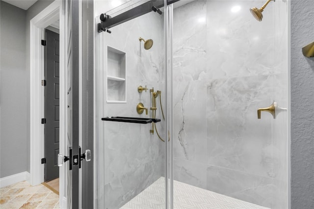 bathroom featuring walk in shower and tile patterned flooring