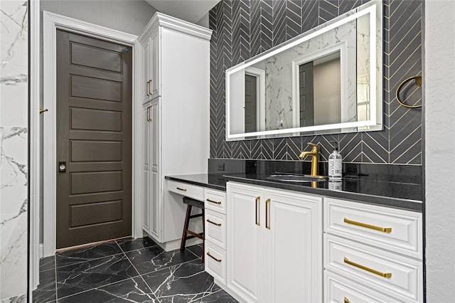 interior space featuring sink and white cabinets