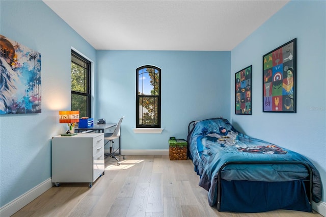 bedroom with light hardwood / wood-style floors