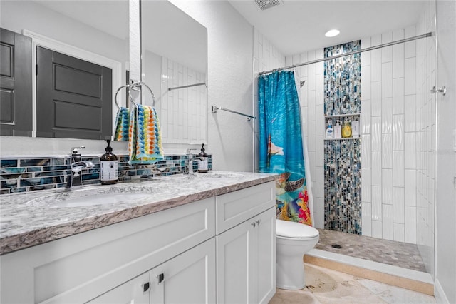 bathroom featuring curtained shower, backsplash, toilet, and vanity