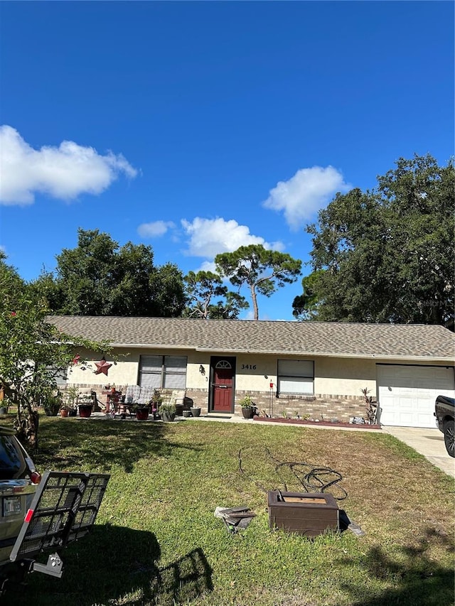 exterior space featuring a front yard and a garage