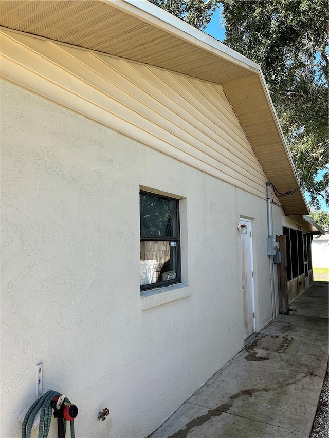 view of property exterior featuring a patio area