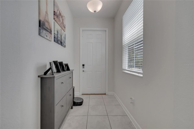 entryway with light tile patterned floors