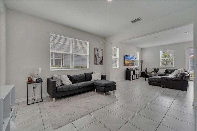 living room with light tile patterned floors