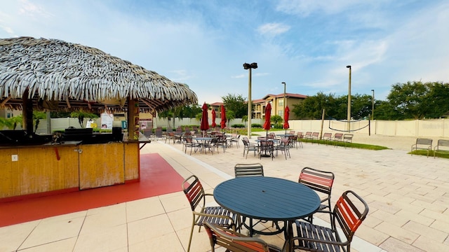 view of patio / terrace with outdoor dining space and fence