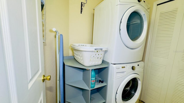 washroom with laundry area and stacked washing maching and dryer