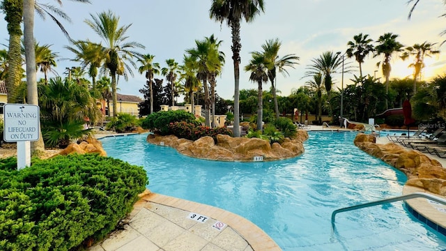 community pool with a patio area