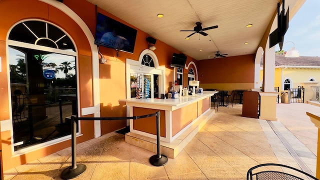 exterior space featuring recessed lighting, wooden ceiling, ceiling fan, and light tile patterned floors