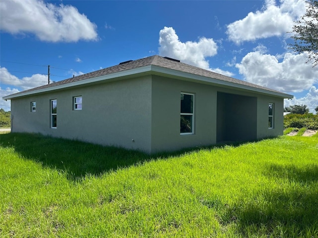 view of property exterior featuring a lawn