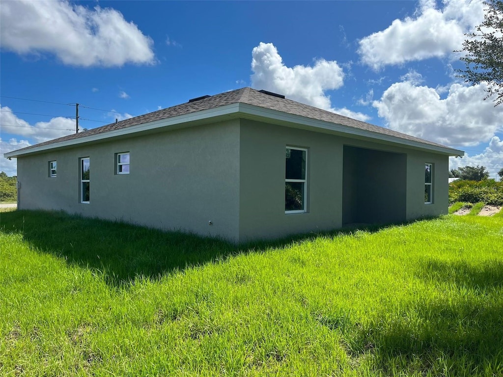 12577 Willmington Blvd, Port Charlotte, FL 33981 - view of side of property with stucco siding