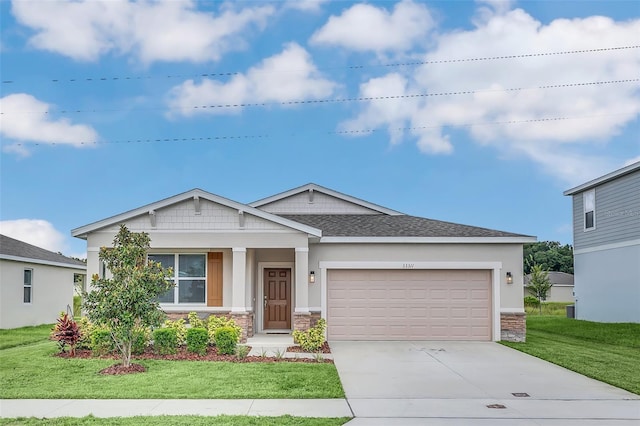 view of front of house with a garage and a front lawn