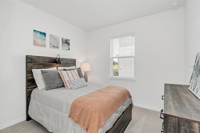 bedroom featuring light colored carpet