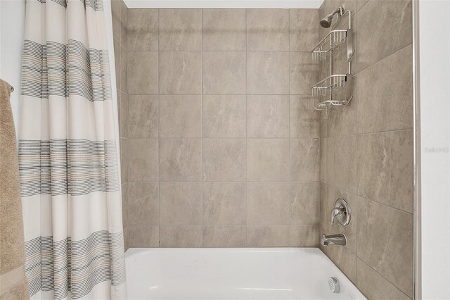 bathroom with shower / tub combo