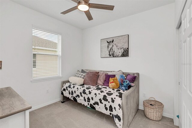 carpeted bedroom featuring ceiling fan