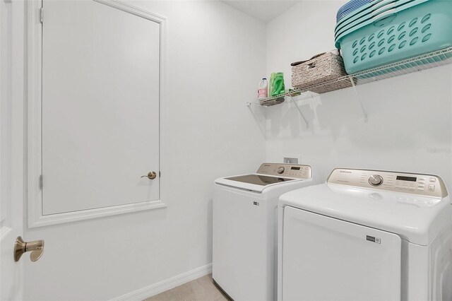 clothes washing area with washer and dryer