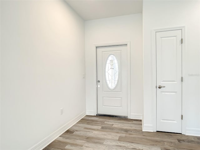 foyer with light hardwood / wood-style floors