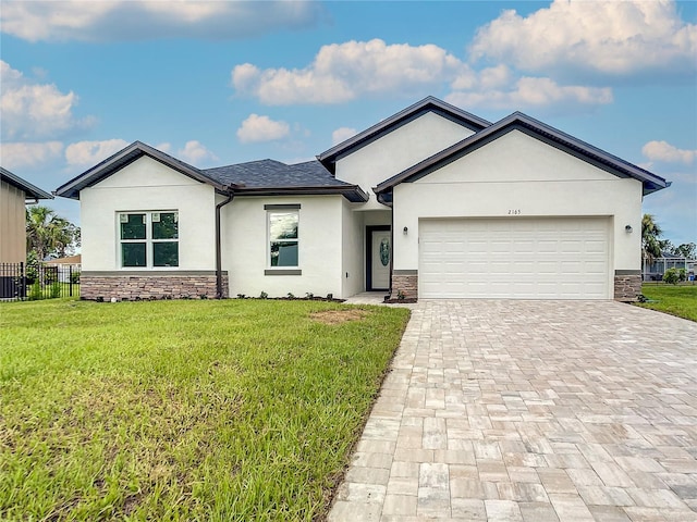 view of front of house with a front lawn and a garage