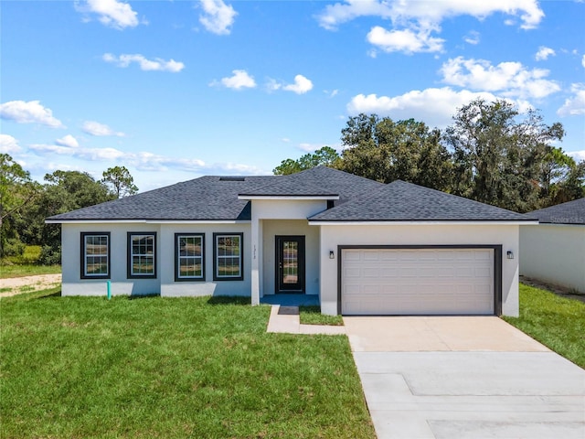 view of front facade with a garage and a front yard